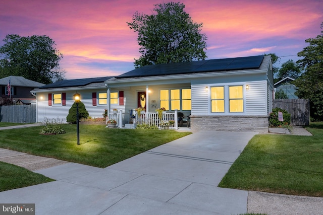 24 Haddon Rd, Somers Point, NJ 08244 - ranch-style house featuring covered porch, solar panels, stone siding, and concrete driveway