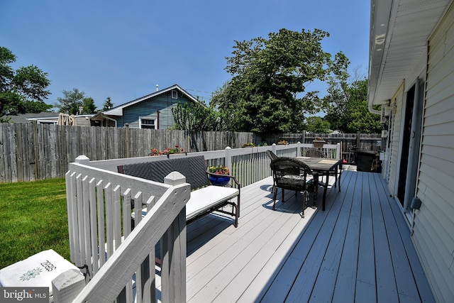 24 Haddon Rd, Somers Point, NJ 08244 - wooden deck with outdoor dining area and a fenced backyard