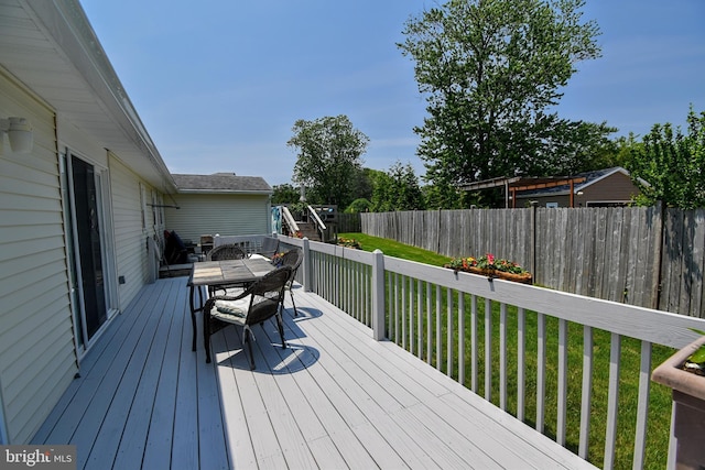 24 Haddon Rd, Somers Point, NJ 08244 - wooden deck with outdoor dining area and a fenced backyard