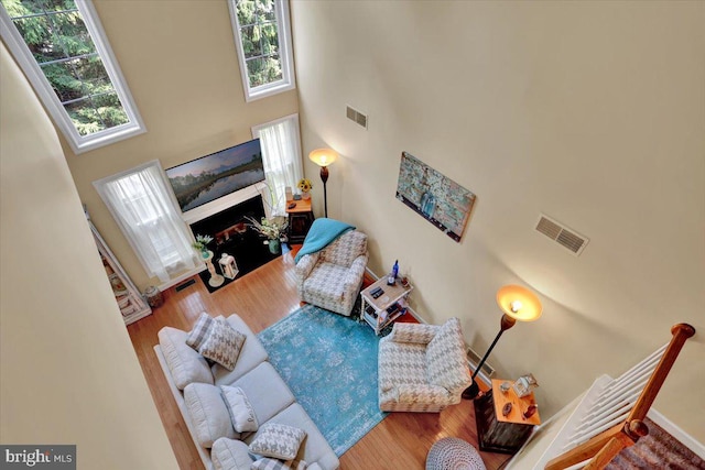14 Wyomissing Ct, Wyomissing, PA 19610 - living area with plenty of natural light, a towering ceiling, wood finished floors, and a fireplace