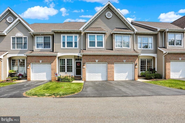 14 Wyomissing Ct, Wyomissing, PA 19610 - multi unit property with driveway, a garage, brick siding, and a shingled roof