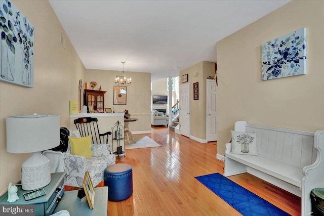14 Wyomissing Ct, Wyomissing, PA 19610 - living room with a chandelier, wood finished floors, and stairs