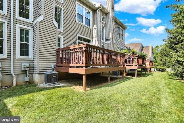 14 Wyomissing Ct, Wyomissing, PA 19610 - back of property with a wooden deck, a chimney, and a lawn