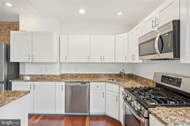 3612 Fait Ave, Baltimore, MD 21224 - kitchen with appliances with stainless steel finishes, stone countertops, white cabinets, dark wood-style floors, and recessed lighting