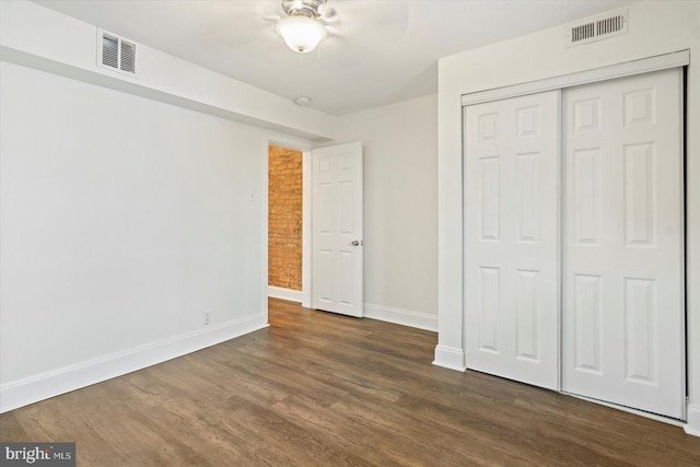 3612 Fait Ave, Baltimore, MD 21224 - unfurnished bedroom featuring dark wood finished floors, a closet, and a ceiling fan