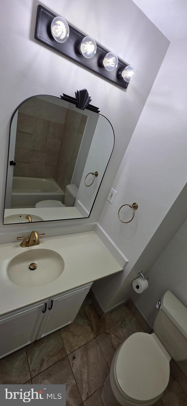 3478 Pence Ct, Annandale, VA 22003 - bathroom with vanity and marble look tile flooring