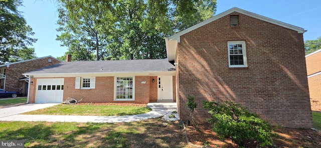 3478 Pence Ct, Annandale, VA 22003 - view of front of home with a garage, brick siding, a front lawn, and concrete driveway