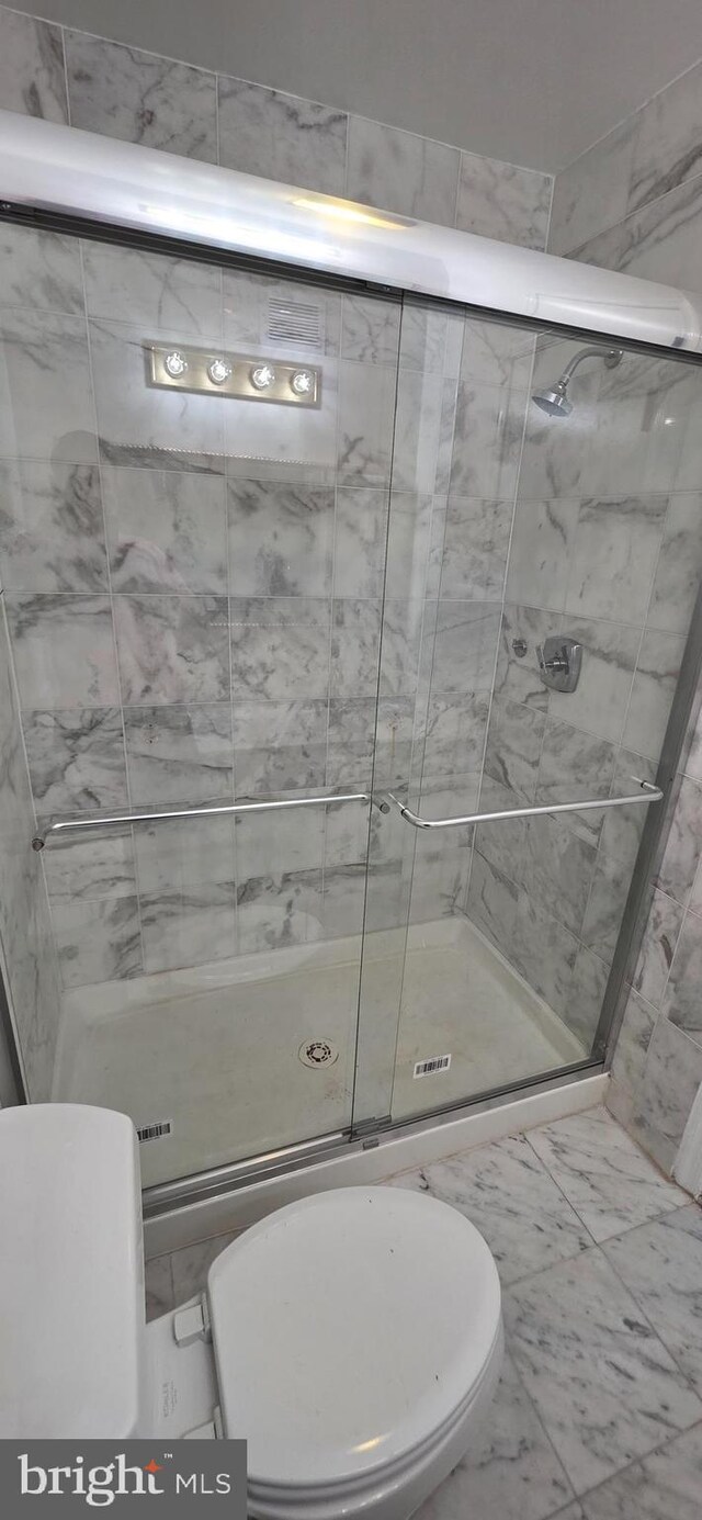 3478 Pence Ct, Annandale, VA 22003 - bathroom with a shower stall and marble finish flooring