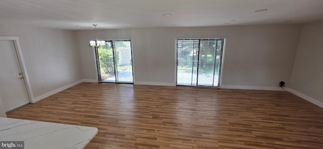 3478 Pence Ct, Annandale, VA 22003 - unfurnished room with wood finished floors, a chandelier, and recessed lighting