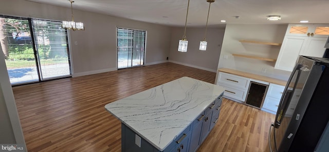 3478 Pence Ct, Annandale, VA 22003 - kitchen featuring healthy amount of natural light, white cabinets, freestanding refrigerator, and recessed lighting