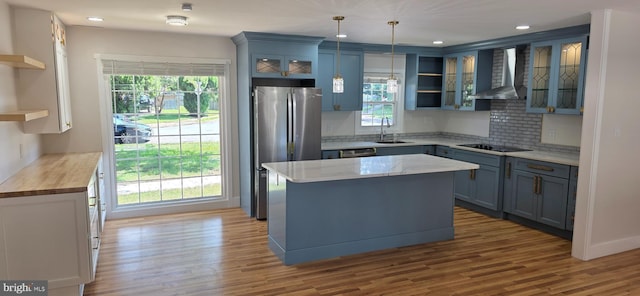 3478 Pence Ct, Annandale, VA 22003 - kitchen featuring open shelves, wall chimney exhaust hood, stainless steel appliances, tasteful backsplash, and recessed lighting
