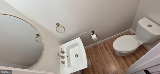 3478 Pence Ct, Annandale, VA 22003 - half bathroom featuring wood finished floors and toilet