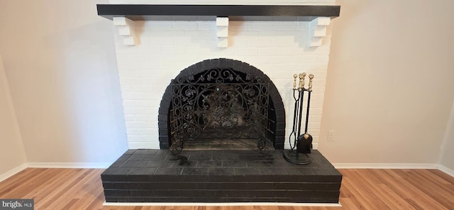3478 Pence Ct, Annandale, VA 22003 - detailed view of wood finished floors and a brick fireplace