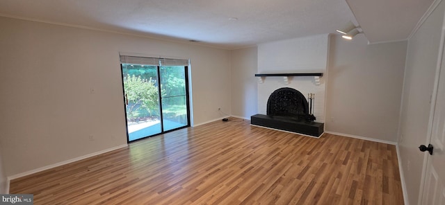 3478 Pence Ct, Annandale, VA 22003 - unfurnished living room with a fireplace, light wood-type flooring, and ornamental molding