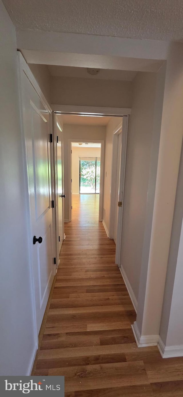 3478 Pence Ct, Annandale, VA 22003 - corridor with light wood-type flooring and a textured ceiling