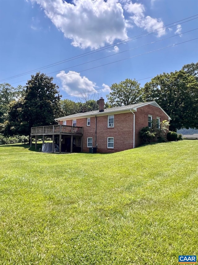 1410 Stevens Cove Rd, Lovingston, VA 22949 - back of property featuring brick siding, a chimney, a yard, and a wooden deck