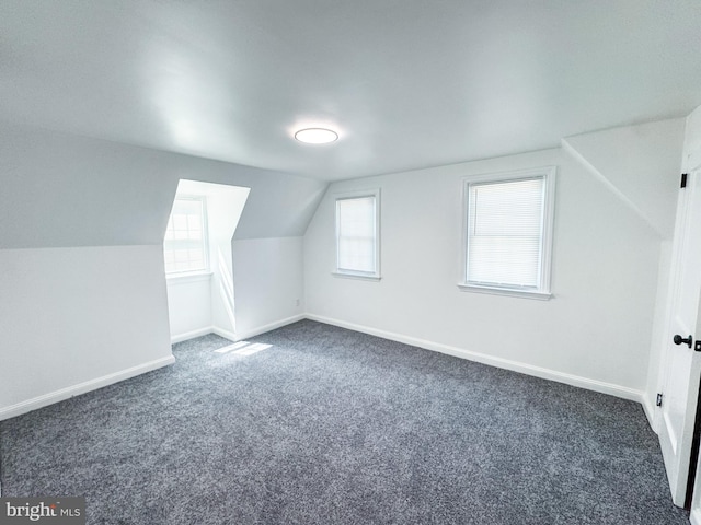 7 N Stuyvesant Dr, Wilmington, DE 19809 - additional living space featuring dark colored carpet, lofted ceiling, and healthy amount of natural light
