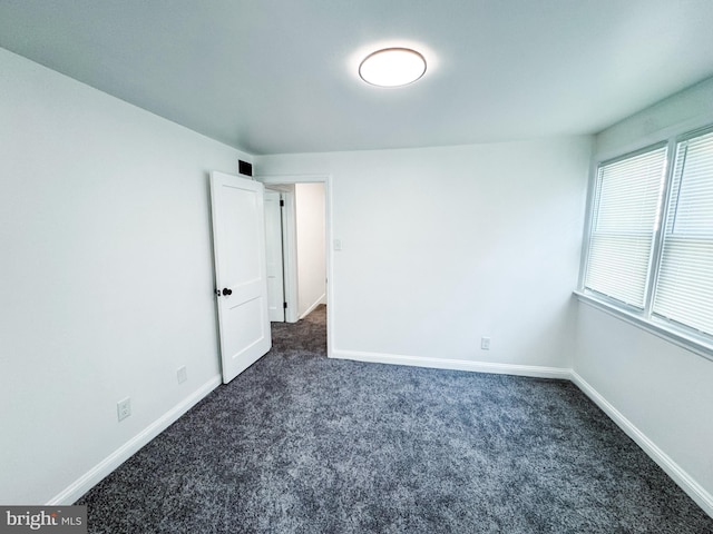 7 N Stuyvesant Dr, Wilmington, DE 19809 - unfurnished room with dark colored carpet and baseboards