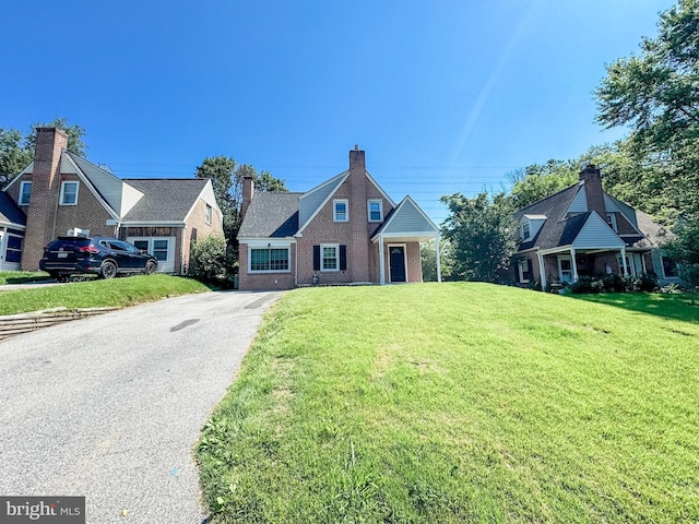 7 N Stuyvesant Dr, Wilmington, DE 19809 - traditional-style home featuring a front lawn, brick siding, and driveway