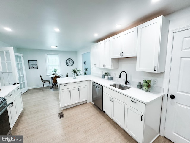 7 N Stuyvesant Dr, Wilmington, DE 19809 - kitchen featuring dishwasher, light countertops, stove, white cabinetry, and recessed lighting
