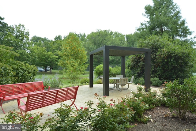 6621 Wakefield Dr Unit 720, Alexandria, VA 22307 - view of community featuring a patio area, outdoor lounge area, a gazebo, and view of wooded area