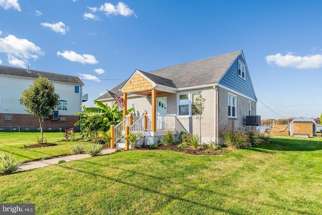 6934 River Drive Rd, Sparrows Point, MD 21219 - view of front of property with brick siding and a front yard
