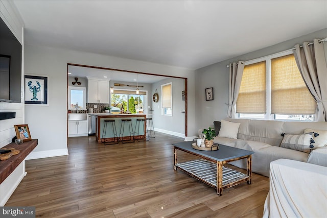 6934 River Drive Rd, Sparrows Point, MD 21219 - living room with dark wood-style floors and baseboards