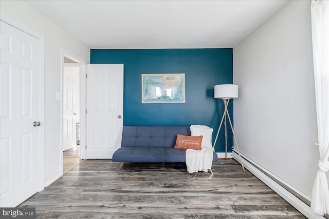 6934 River Drive Rd, Sparrows Point, MD 21219 - living area with baseboard heating and wood finished floors