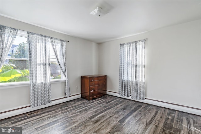 6934 River Drive Rd, Sparrows Point, MD 21219 - empty room with wood finished floors, a baseboard radiator, and baseboard heating