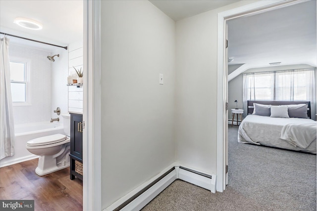 6934 River Drive Rd, Sparrows Point, MD 21219 - bedroom featuring a baseboard heating unit and wood finished floors