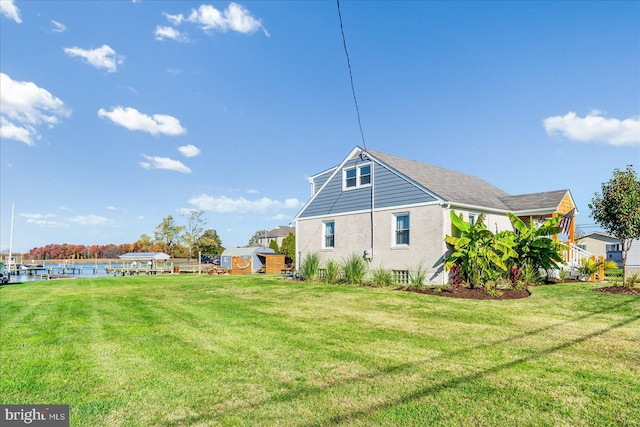 6934 River Drive Rd, Sparrows Point, MD 21219 - rear view of property featuring a lawn
