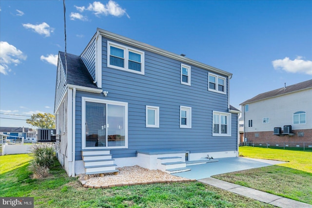 6934 River Drive Rd, Sparrows Point, MD 21219 - rear view of property featuring a yard, a patio area, and entry steps