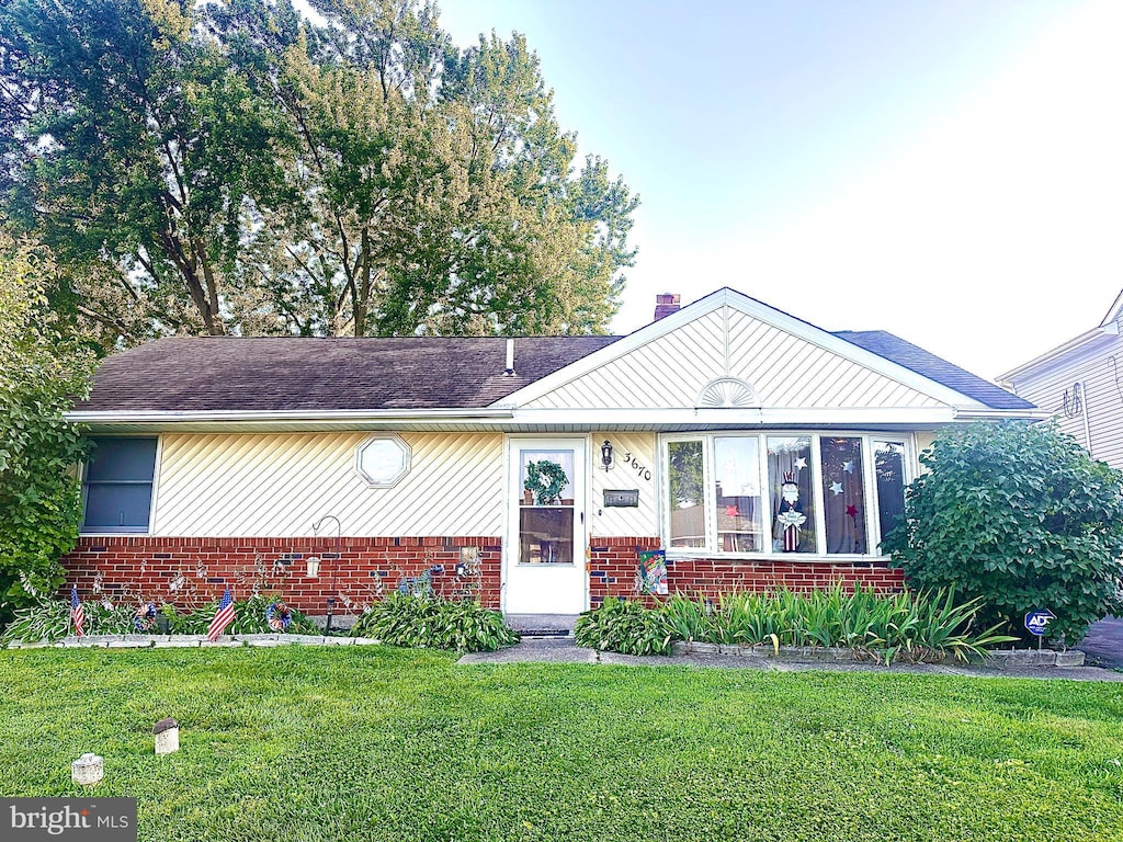 3670 Kingston Way, Bensalem, PA 19020 - ranch-style house with brick siding, a front lawn, and a chimney