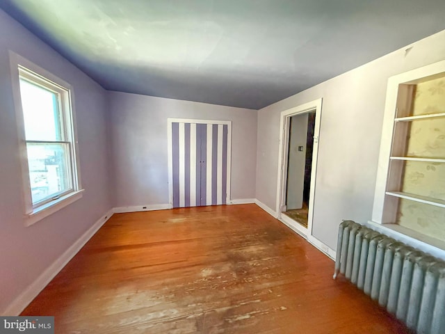 507 Market St, New Cumberland, PA 17070 - unfurnished room featuring radiator heating unit and wood finished floors