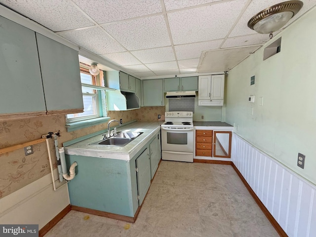 507 Market St, New Cumberland, PA 17070 - kitchen with white electric stove, under cabinet range hood, a paneled ceiling, green cabinetry, and light countertops