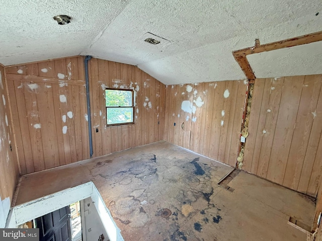 507 Market St, New Cumberland, PA 17070 - bonus room with lofted ceiling, wood walls, and a textured ceiling