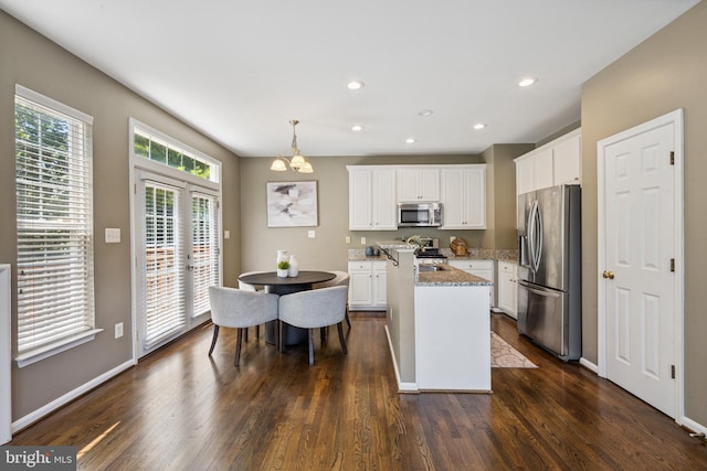 8562 Wyngate Manor Ct, Alexandria, VA 22309 - kitchen with stainless steel appliances, dark wood finished floors, a kitchen island, a chandelier, and recessed lighting