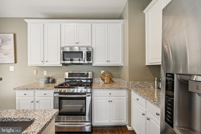 8562 Wyngate Manor Ct, Alexandria, VA 22309 - kitchen with appliances with stainless steel finishes, white cabinetry, and light stone counters