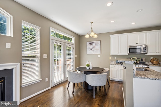 8562 Wyngate Manor Ct, Alexandria, VA 22309 - kitchen featuring stainless steel appliances, a chandelier, dark wood-style floors, white cabinets, and recessed lighting
