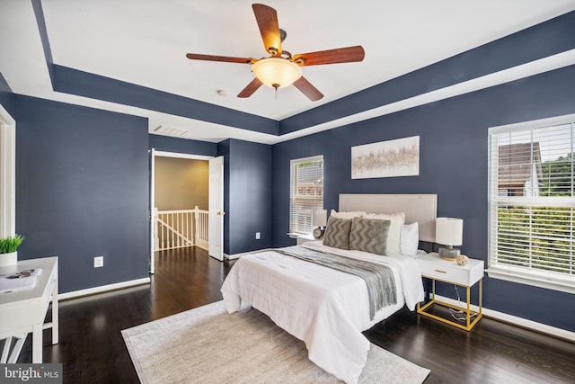 8562 Wyngate Manor Ct, Alexandria, VA 22309 - bedroom with a tray ceiling, wood finished floors, and a ceiling fan