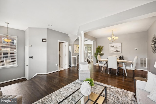 8562 Wyngate Manor Ct, Alexandria, VA 22309 - living area with ornate columns, wood finished floors, and a chandelier