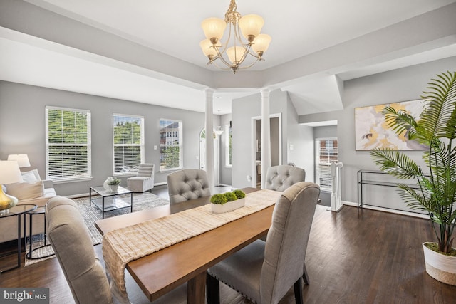 8562 Wyngate Manor Ct, Alexandria, VA 22309 - dining room featuring ornate columns, wood finished floors, and a chandelier