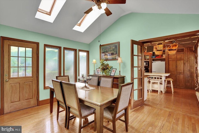 270 Gouglersville Rd, Reading, PA 19608 - dining area with ceiling fan, lofted ceiling, a skylight, and light wood-style flooring