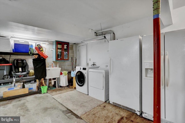 270 Gouglersville Rd, Reading, PA 19608 - garage with washing machine and dryer and white refrigerator with ice dispenser