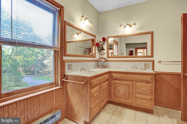 270 Gouglersville Rd, Reading, PA 19608 - bathroom featuring wainscoting, double vanity, tasteful backsplash, tile patterned floors, and wooden walls
