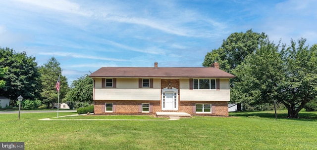 640 Bollinger Rd, Littlestown, PA 17340 - split foyer home with a front lawn and brick siding