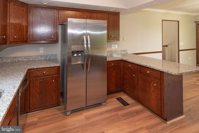 640 Bollinger Rd, Littlestown, PA 17340 - kitchen featuring appliances with stainless steel finishes, ornamental molding, light wood-type flooring, a peninsula, and light stone countertops
