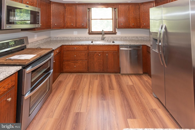 640 Bollinger Rd, Littlestown, PA 17340 - kitchen featuring stainless steel appliances, brown cabinetry, and plenty of natural light