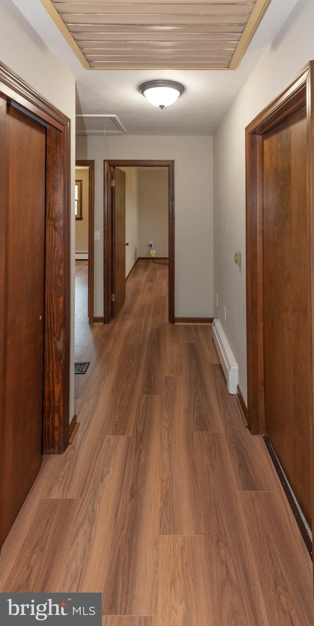 640 Bollinger Rd, Littlestown, PA 17340 - hallway with baseboard heating, attic access, and wood finished floors