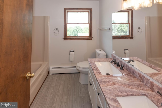 640 Bollinger Rd, Littlestown, PA 17340 - bathroom featuring a baseboard radiator, double vanity, and wood finished floors